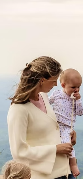 Founder holding her daughter